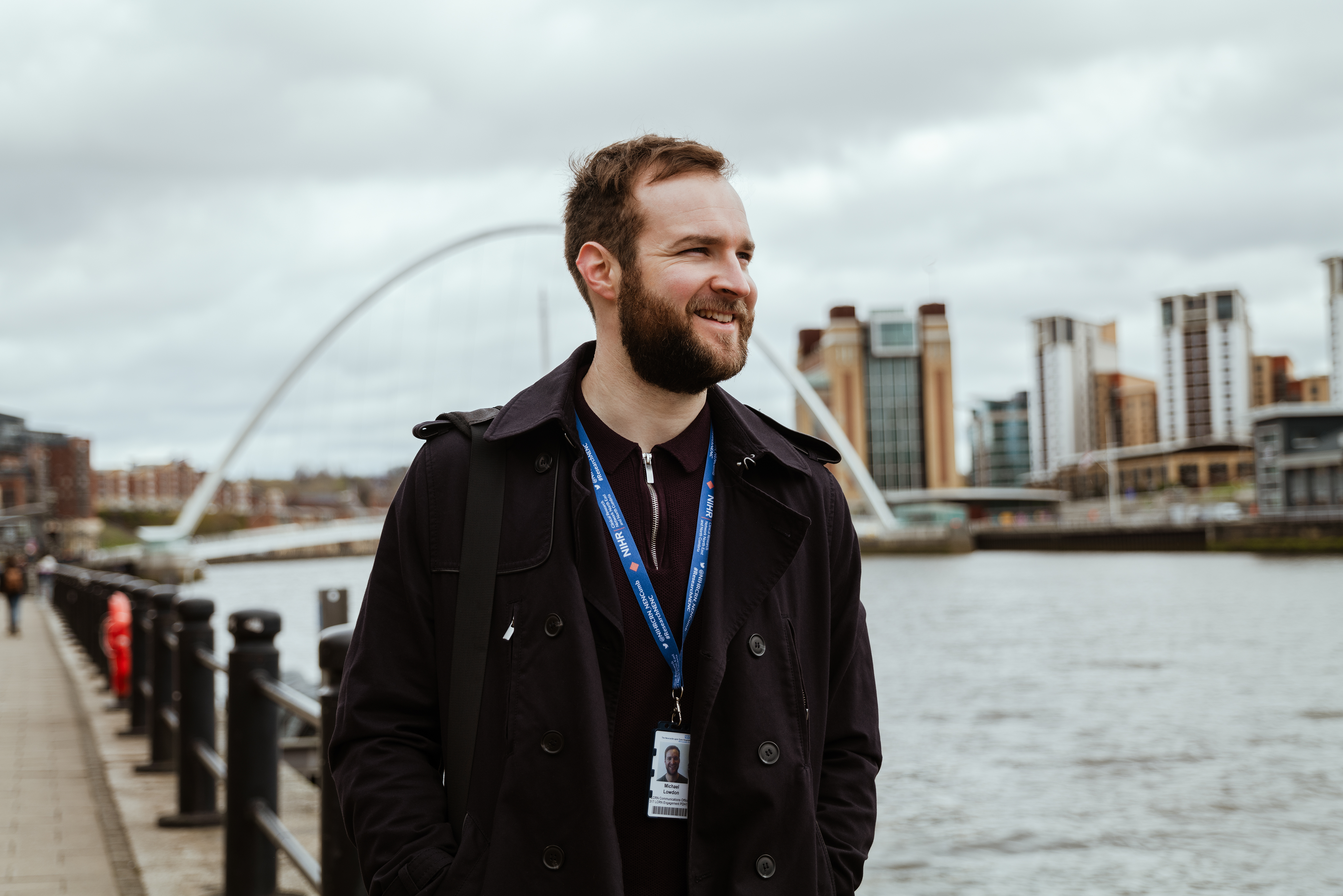 Micheal standing on the side of the River Tyne