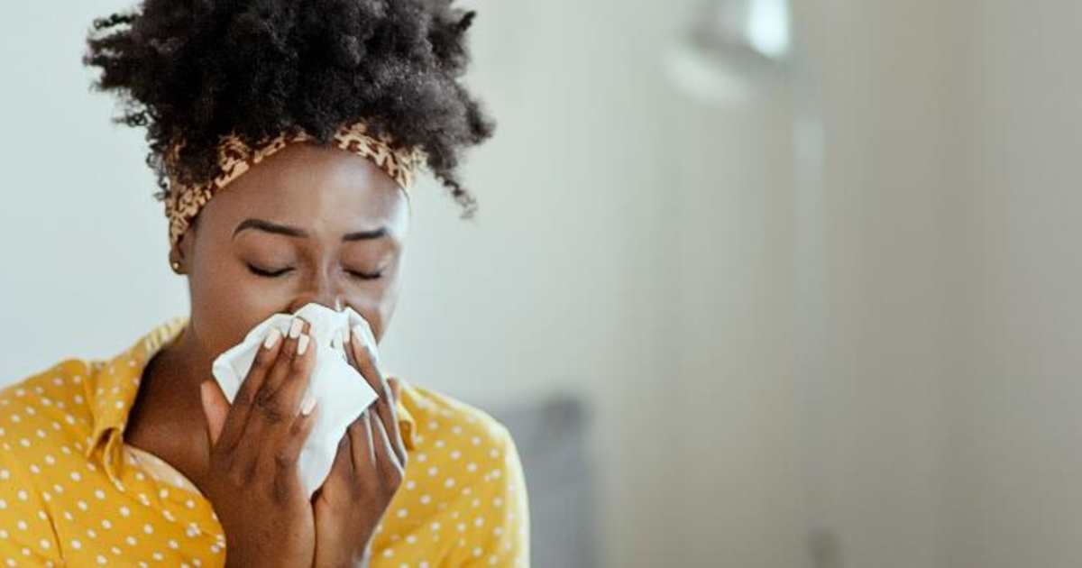 Woman sneezing